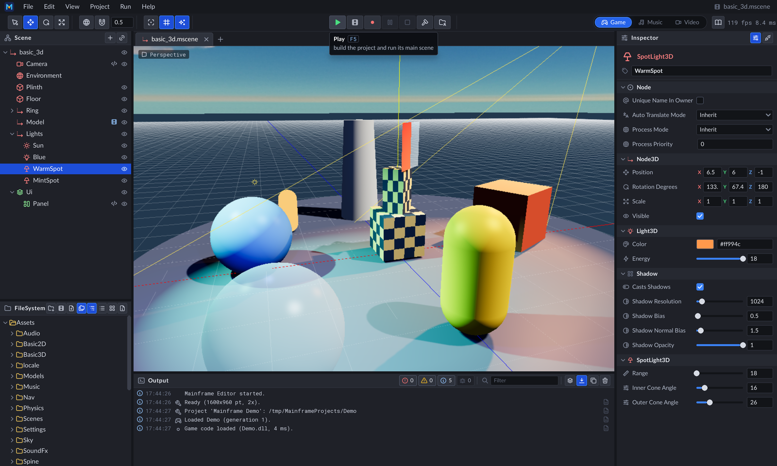 The editor: a 3D scene with a spot light selected, its inspector, the FileSystem and Output panels